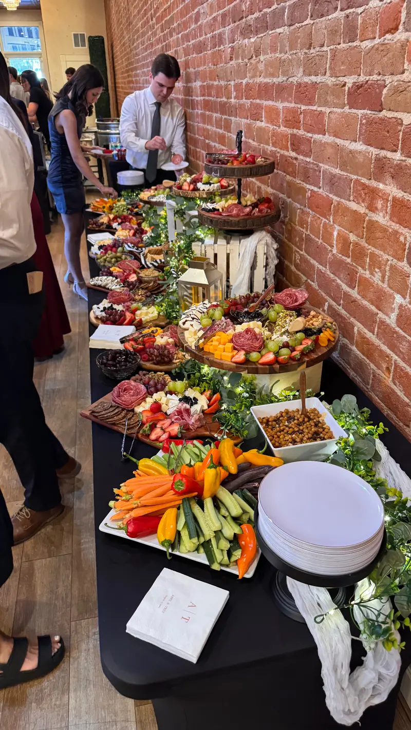 Grazing table with charcuterie, fruit and vegetables at an event